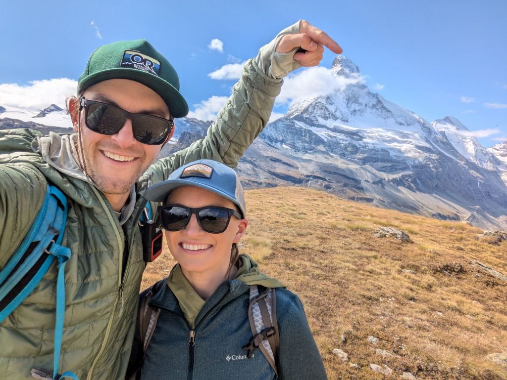 Molly and JD pose in front of the Matterhorn
